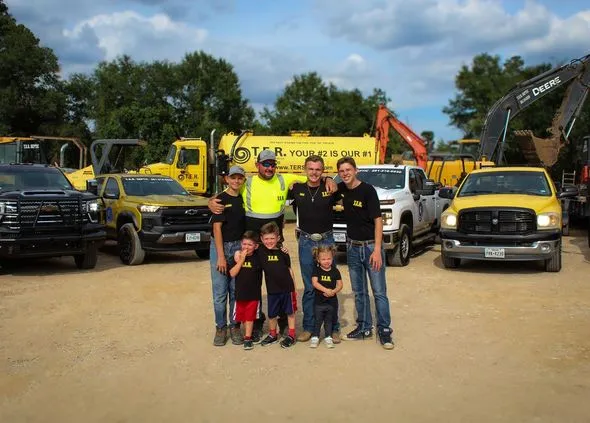 The Ratliff family in front of the T.E.R. Septic trucks